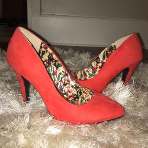 Woman’s red pumps